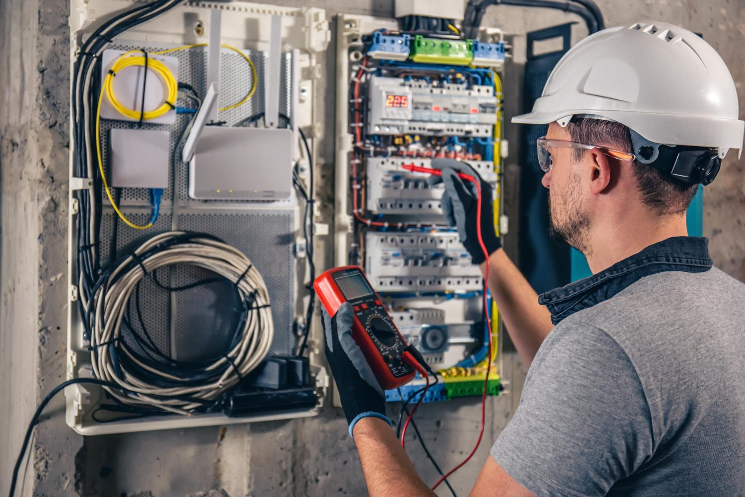 Licensed electrician working on electrical panel in Winnipeg