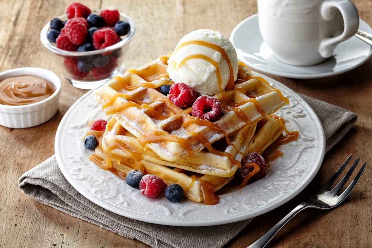 Gourmet Belgian waffle with fresh berries and whipped cream