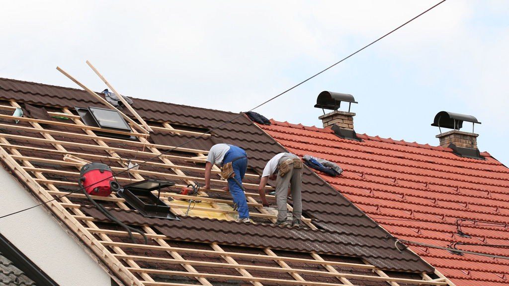Roofing team working on residential roof