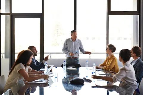 Strategic communications professionals in a boardroom meeting