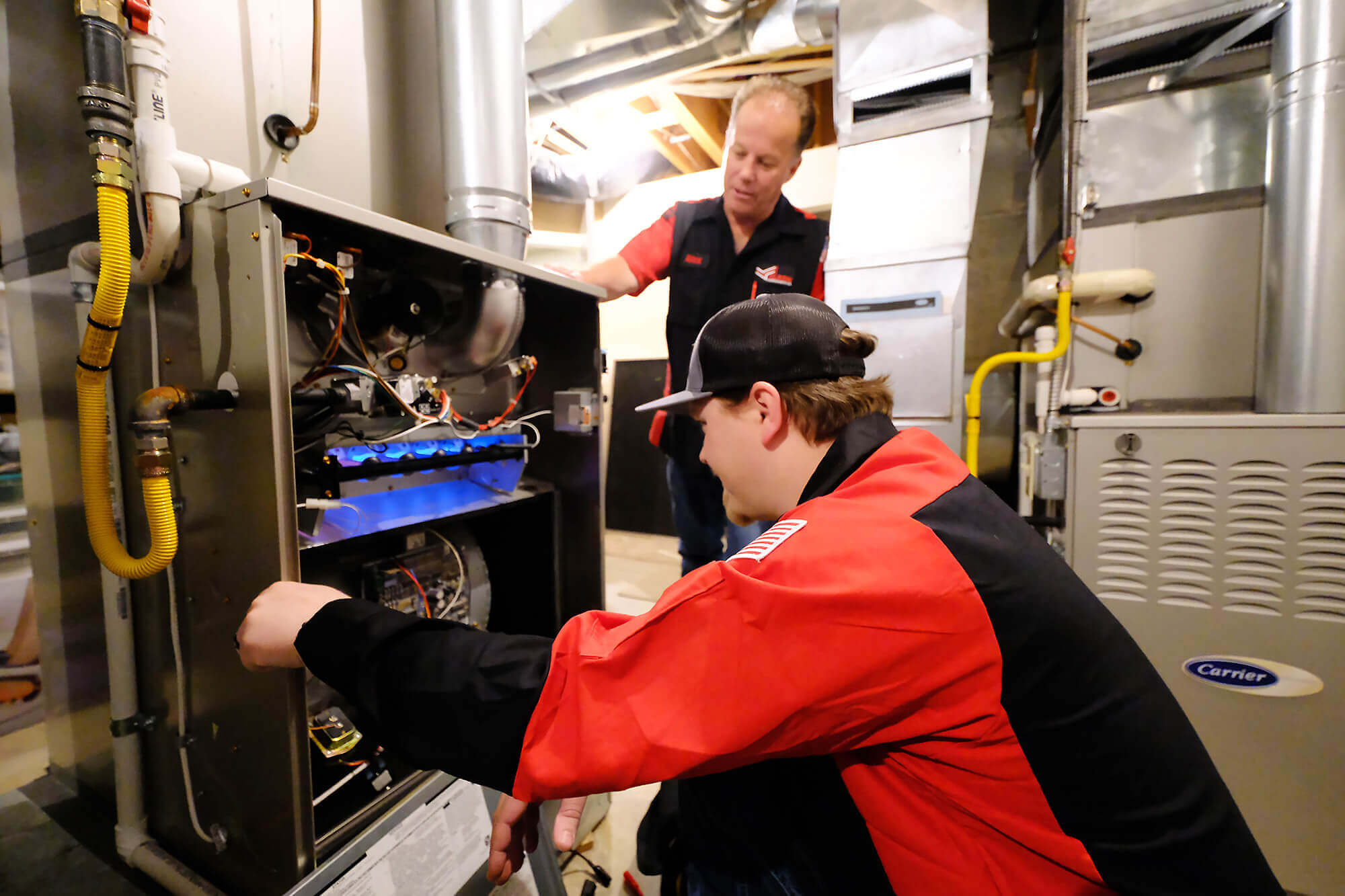 Colby Plumbing technicians servicing a heating system