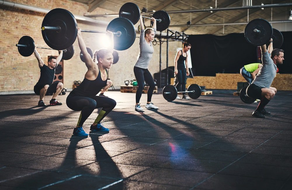 CrossFit athletes lifting barbells during a group WOD at CrossFit Currie Barracks in Calgary