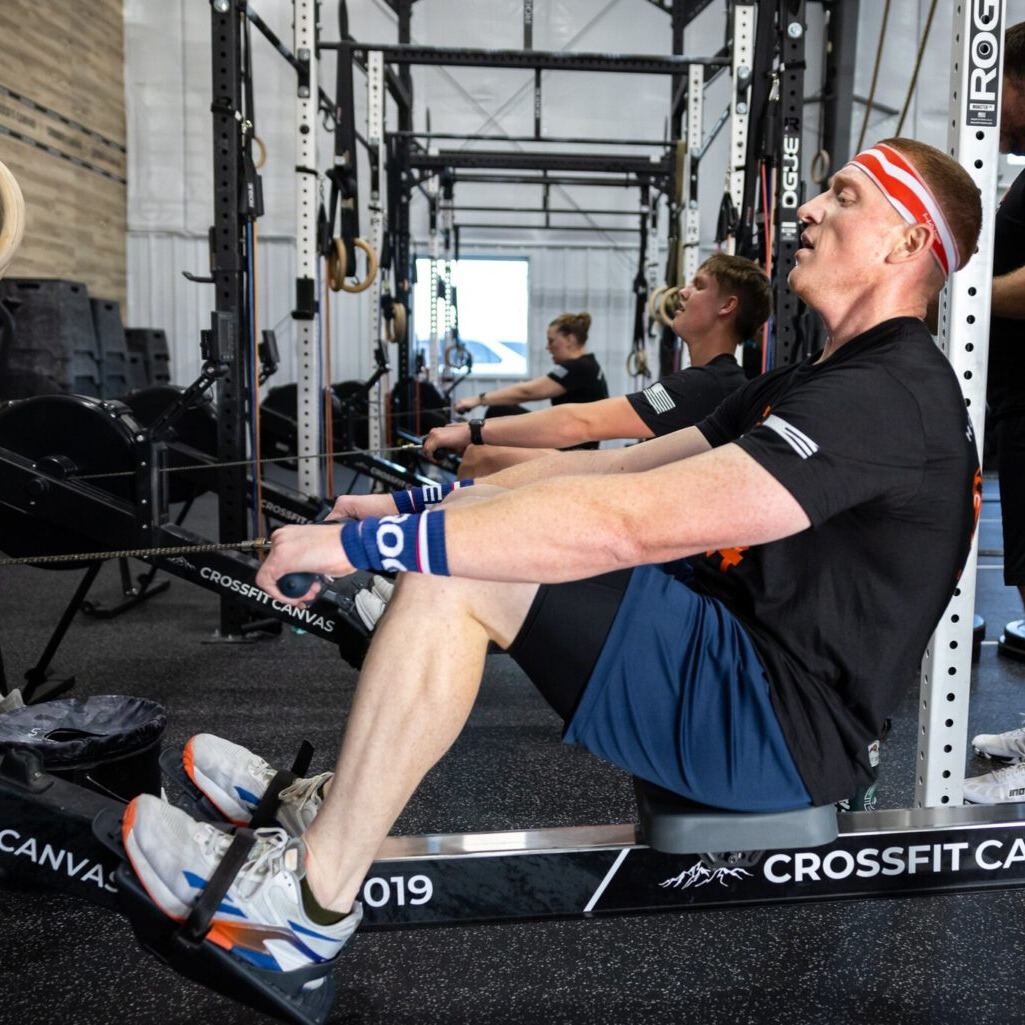Athletes training on rowing machines at Dark Leopard CrossFit