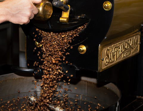 Coffee beans being roasted in a vintage San Franciscan roaster