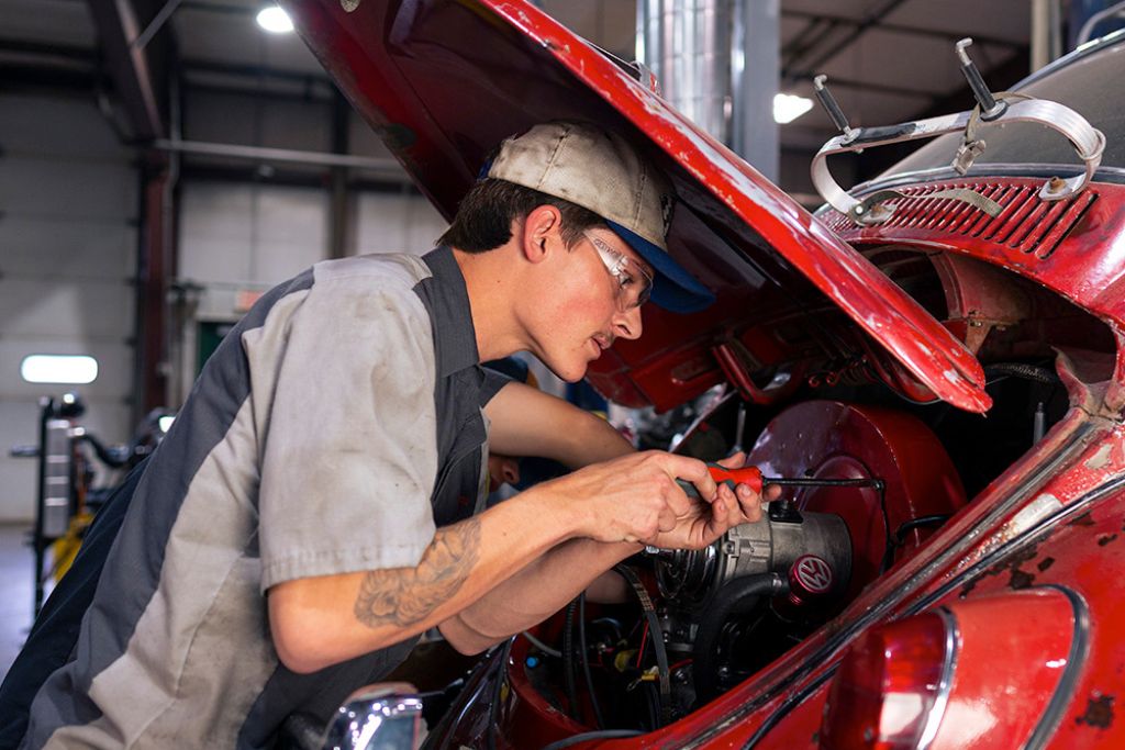 Certified mechanic working on a vehicle at Decent Auto Repair