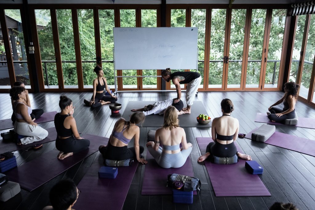 Group yoga class with instructor at Distrikt Movement