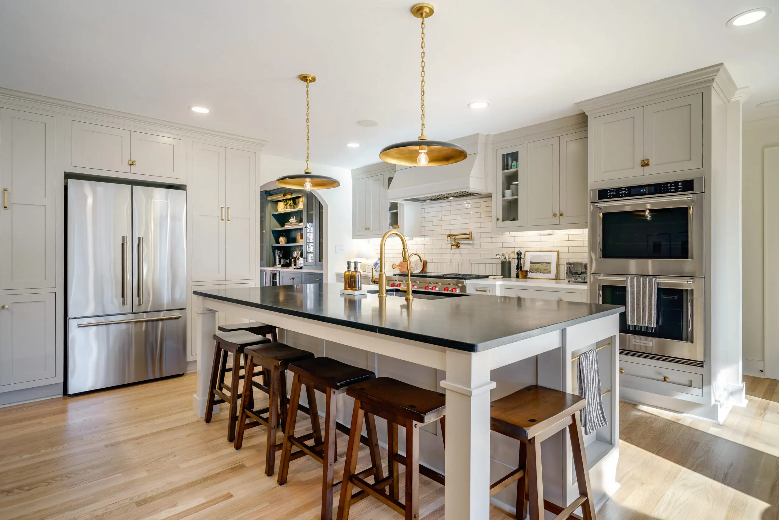 Modern kitchen renovation with island and pendant lighting