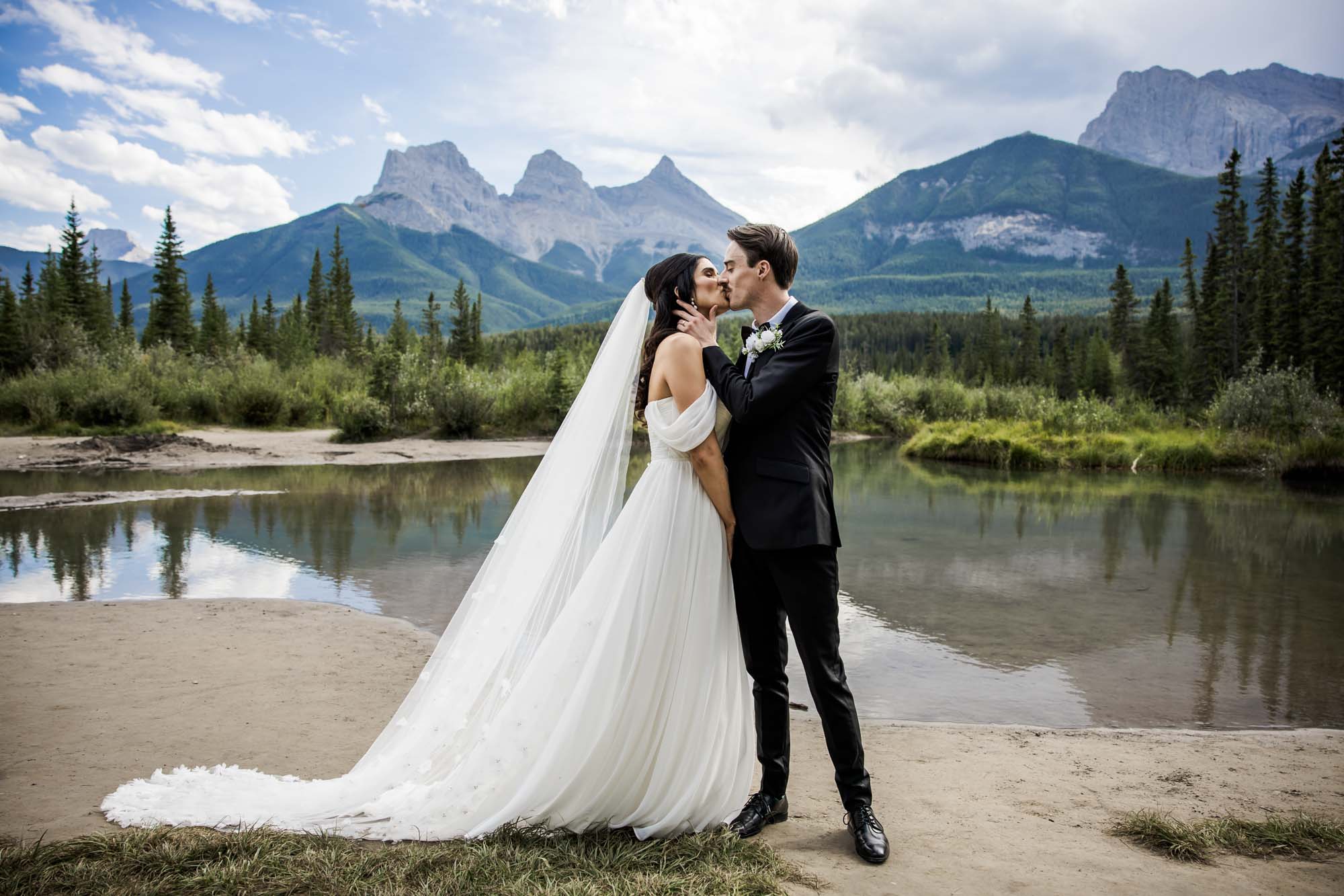 Wedding couple portrait with Rocky Mountains backdrop near Calgary