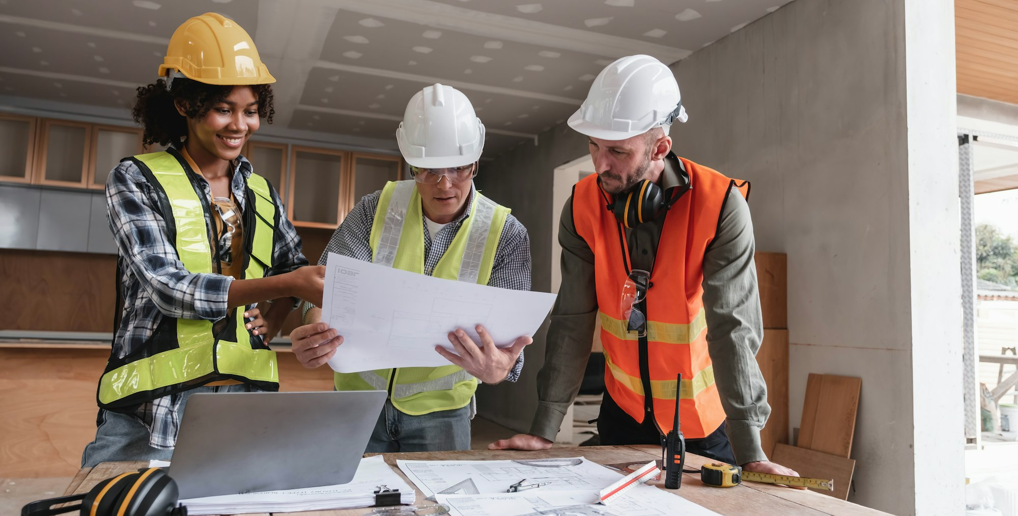FF Construction team reviewing project plans on site