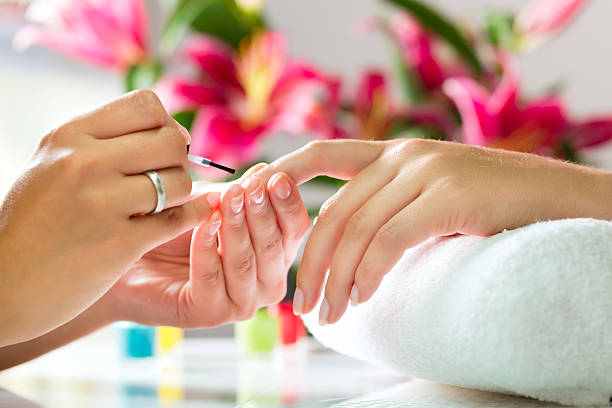 Professional nail technician giving a luxury manicure