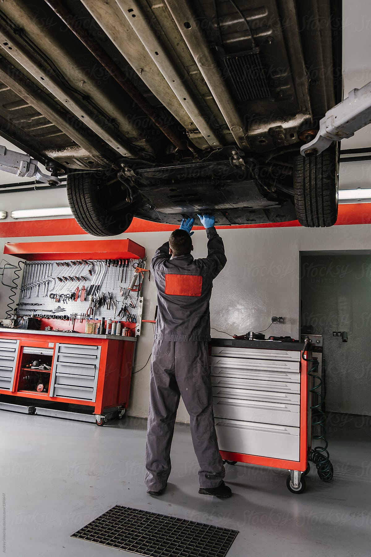 Certified mechanic working on a vehicle at Fred's Automotive