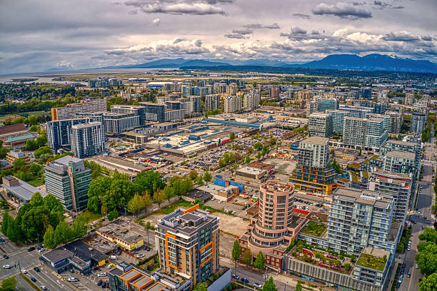 Aerial view of Richmond BC skyline with mountains