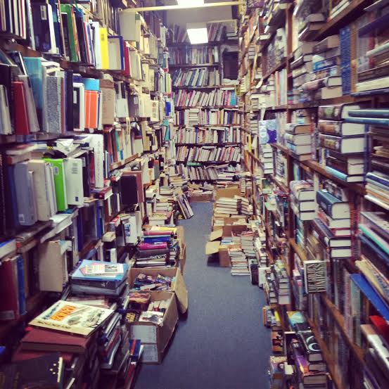 Overflowing bookshelves in the Doull bookstore interior
