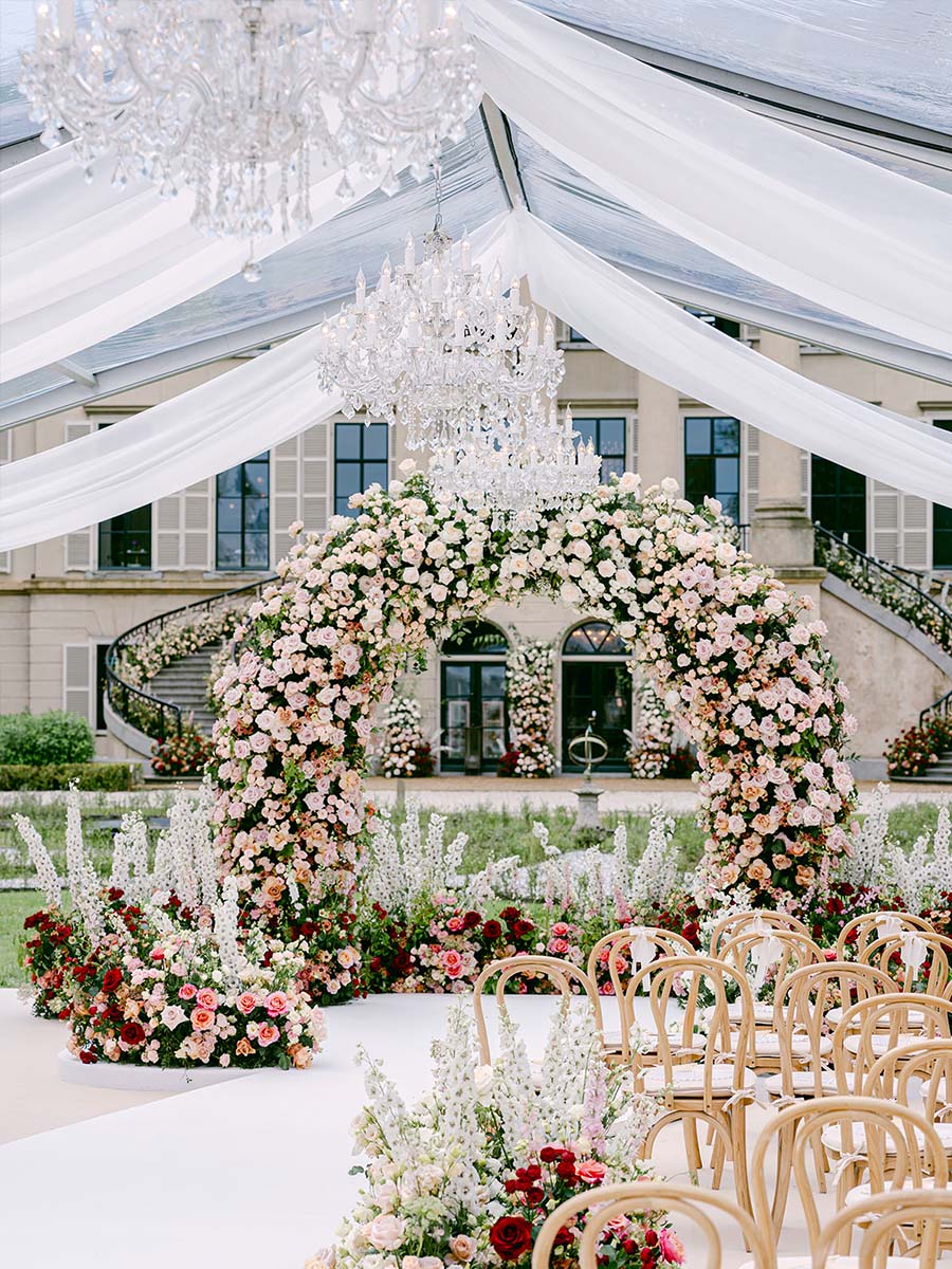 Luxury wedding ceremony arch with stunning floral arrangements