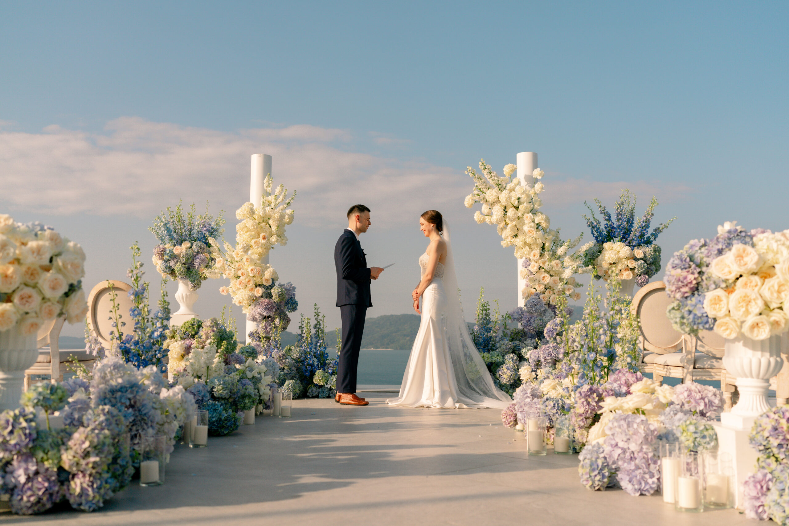 Luxury outdoor wedding ceremony with stunning floral arrangements