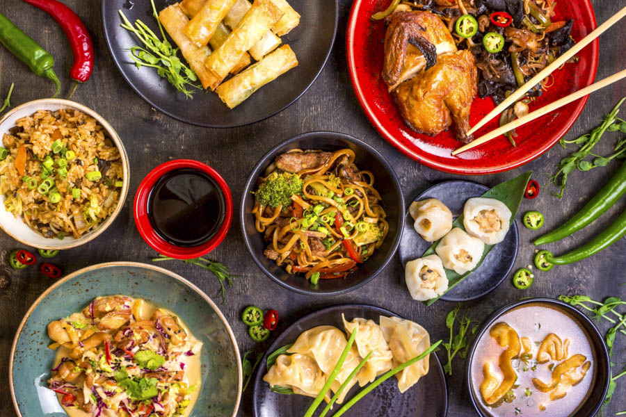 Delicious Chinese cuisine spread with noodles, dumplings, and stir-fry dishes