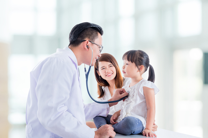 Family doctor caring for a young patient at La Ronge Medical Clinic