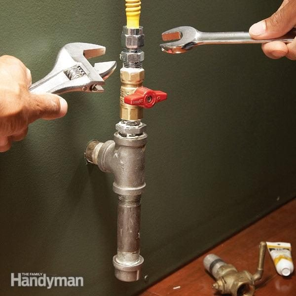 Licensed gas fitter installing gas pipe line