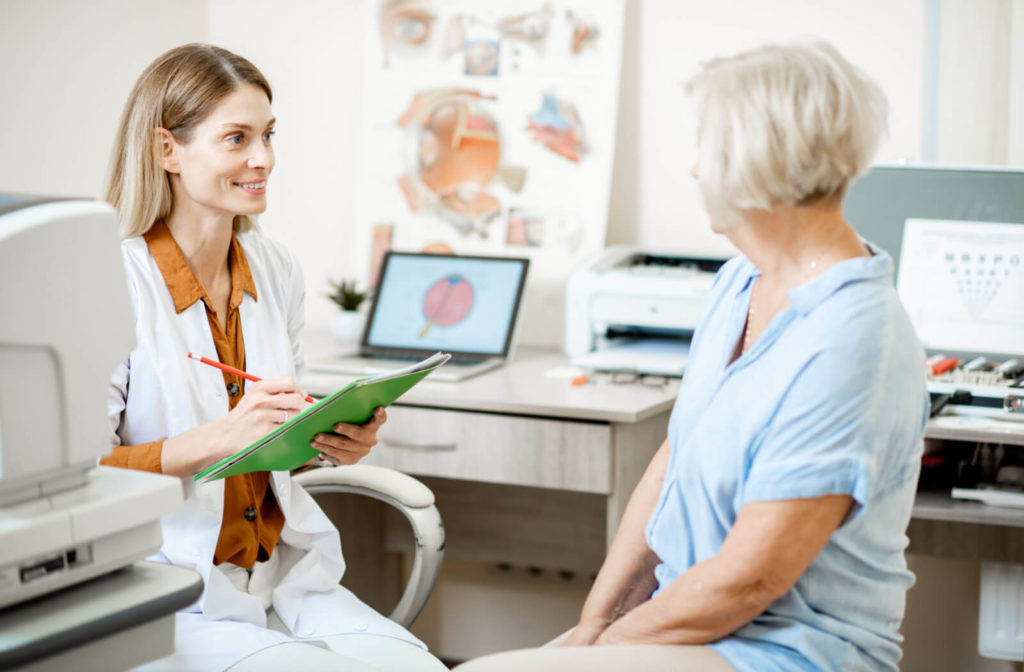 Dr. MacPherson and Dr. Bock consulting with a patient