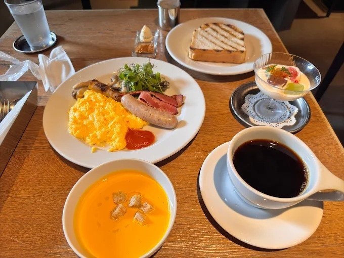 Beautifully presented Japanese breakfast set with rice, salmon, and miso soup