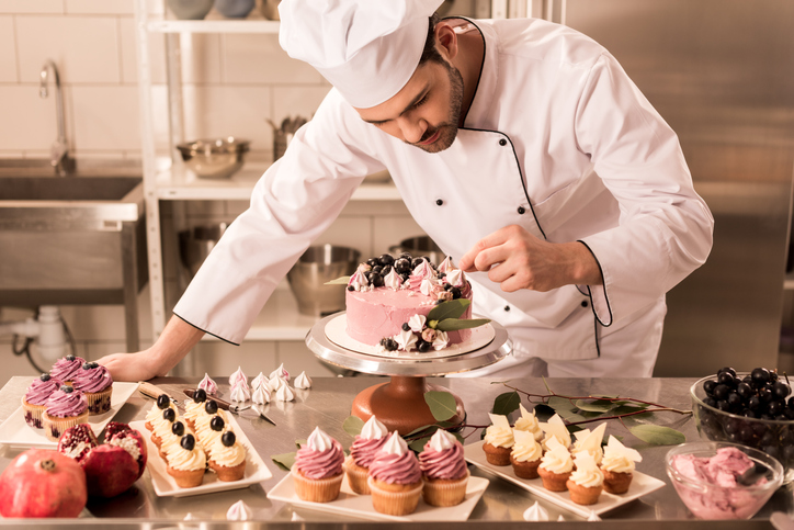 Cake decorator at work in the kitchen