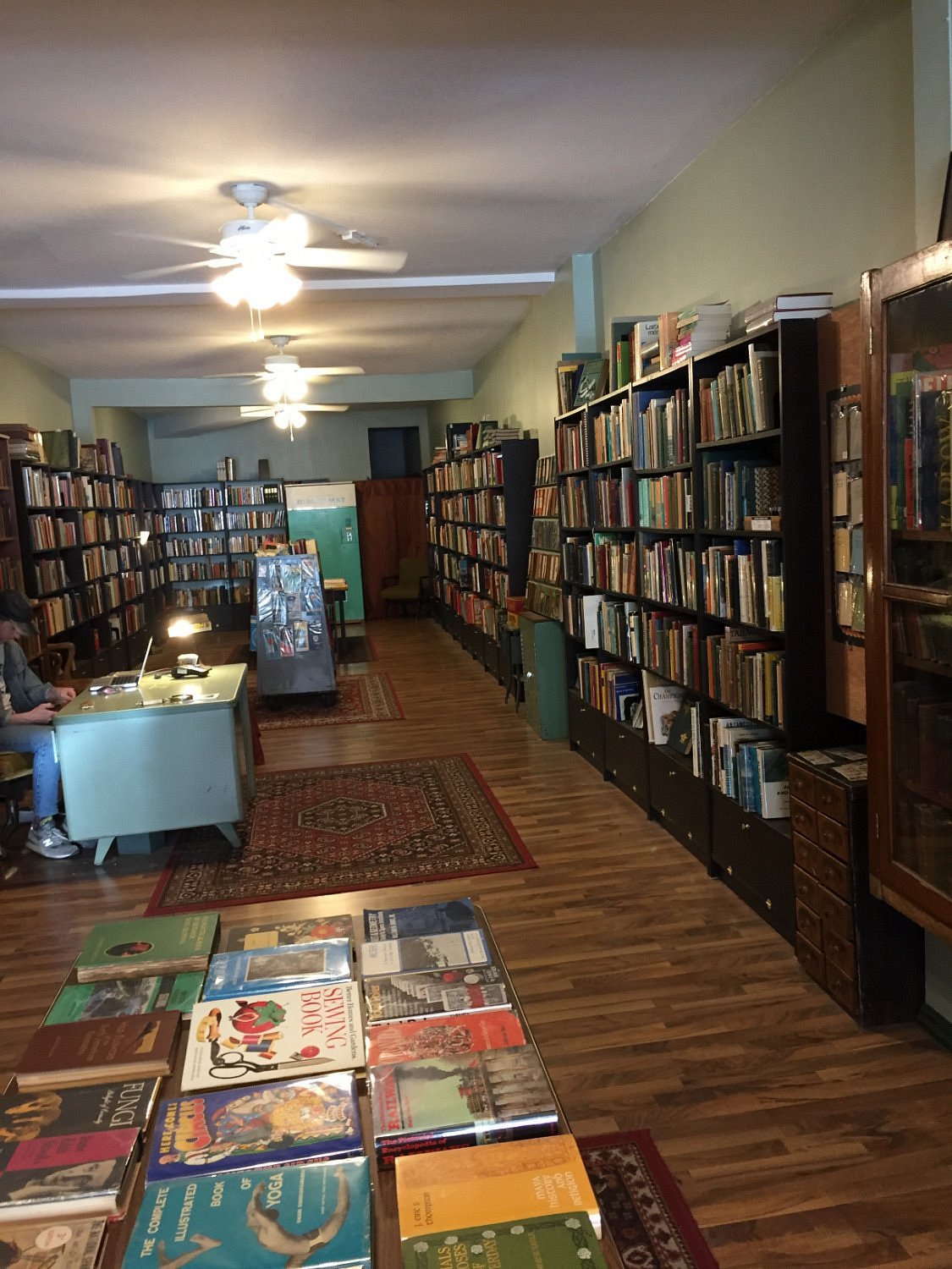 The interior of The Monkey's Paw bookshop in Toronto, showing floor-to-ceiling bookshelves