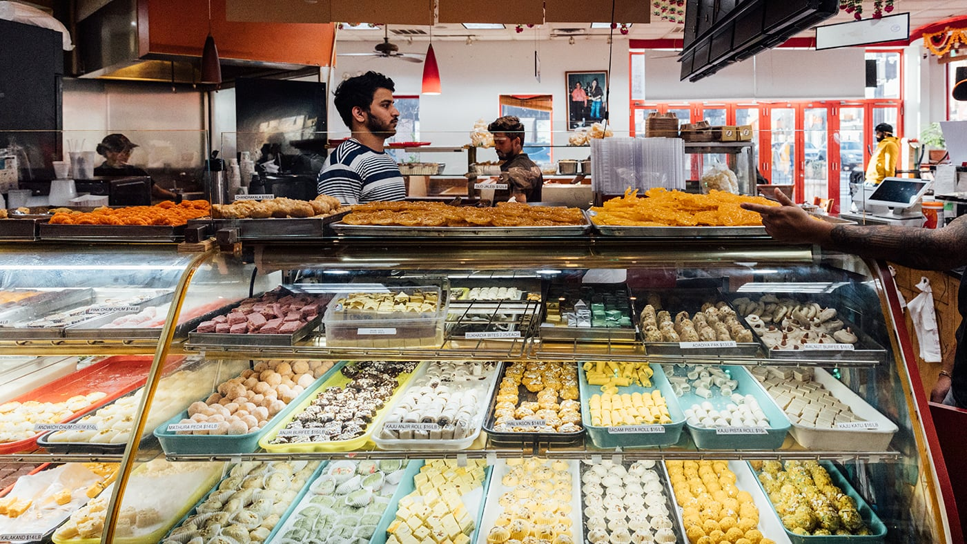 Colorful display of South Asian mithai and traditional sweets