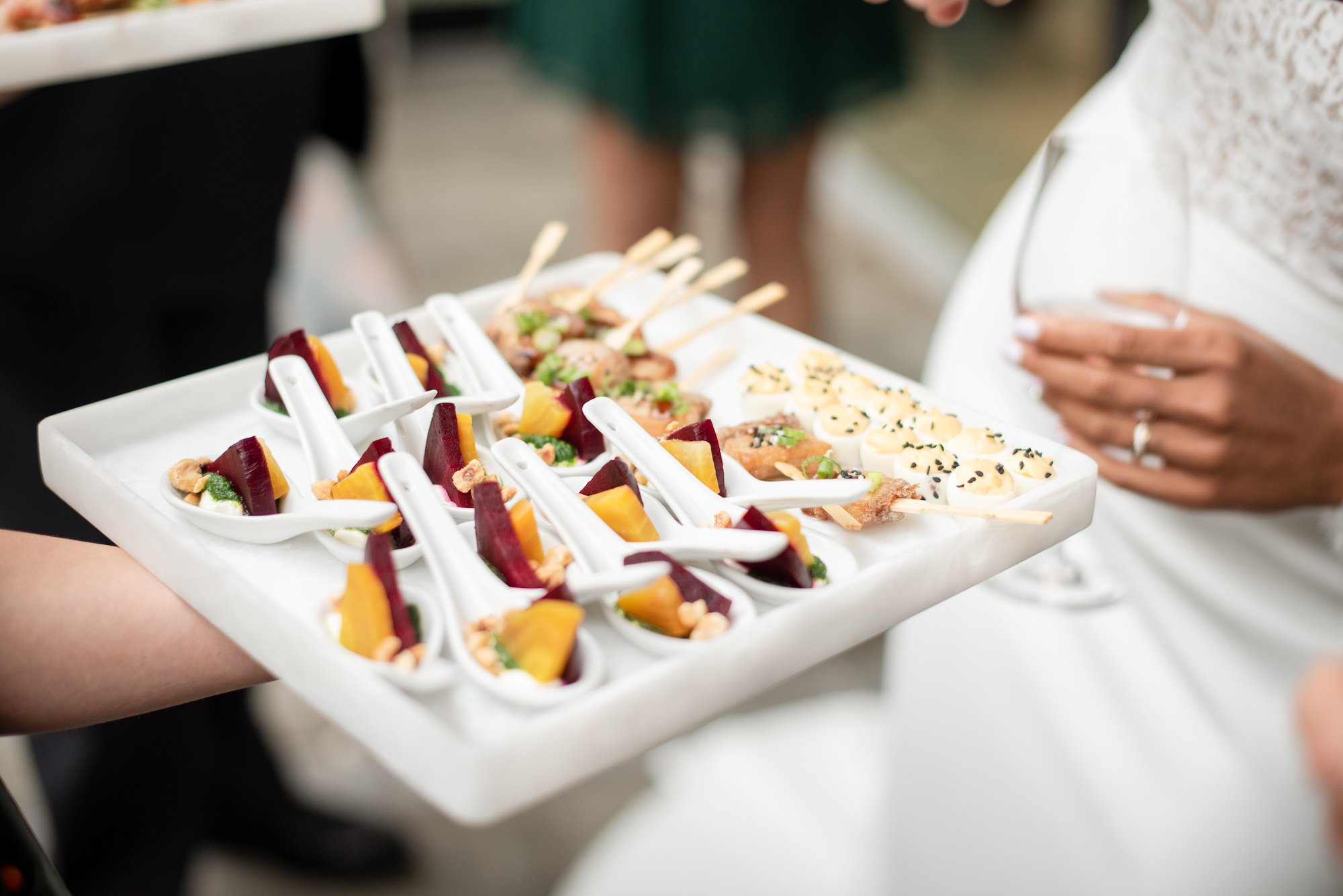 Professional catering service with elegant canap&eacute;s at a wedding event