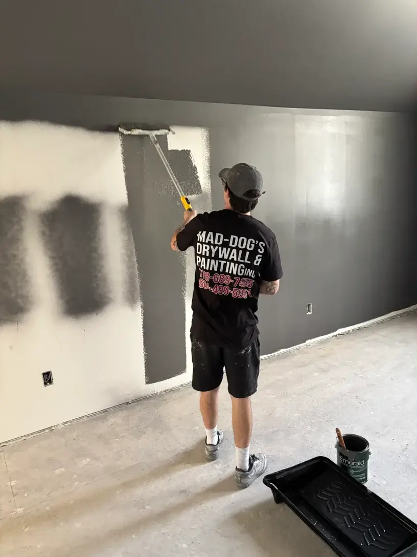 Professional painter working on interior wall in Vancouver home