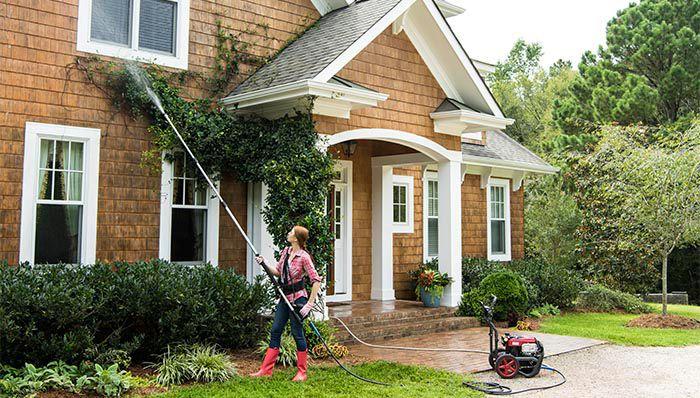 Power washing driveway before and after
