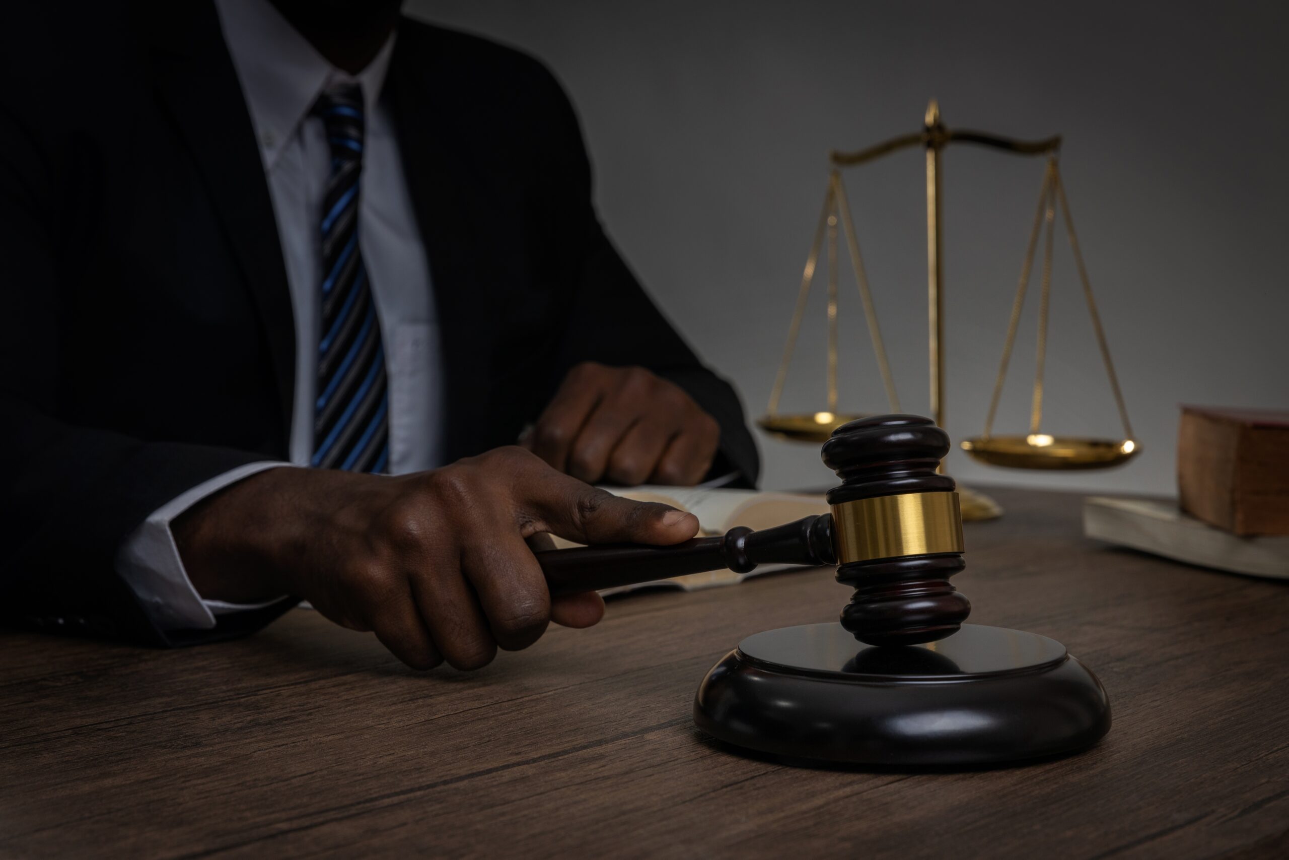 Criminal defence lawyer with gavel and scales of justice