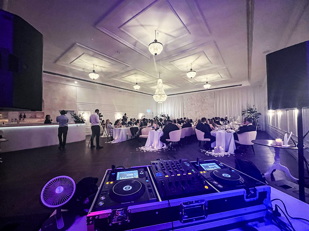 Professional wedding DJ setup with premium equipment and lighting